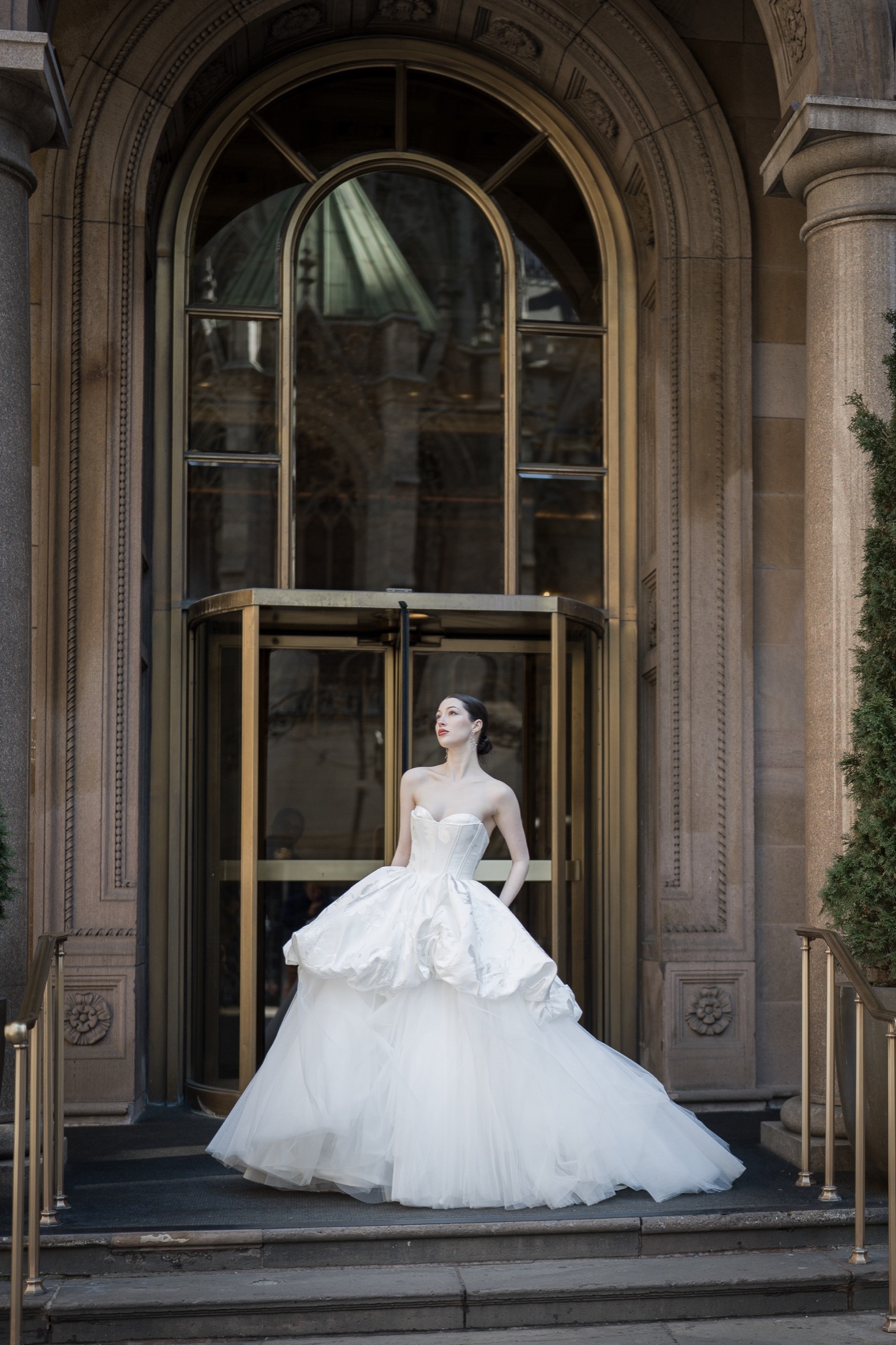 Bride beneath an architectural arch