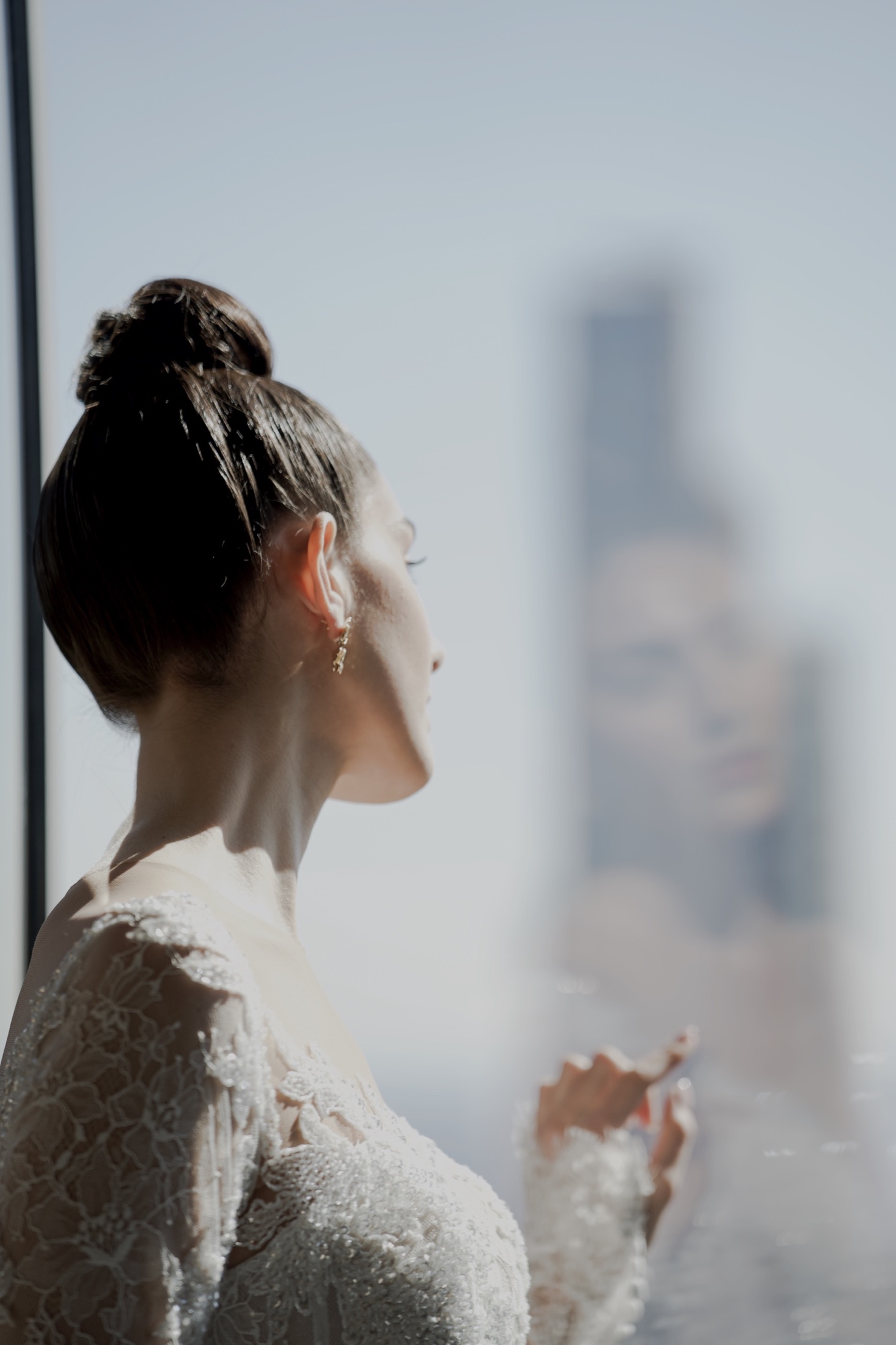 Bride reflected in a window