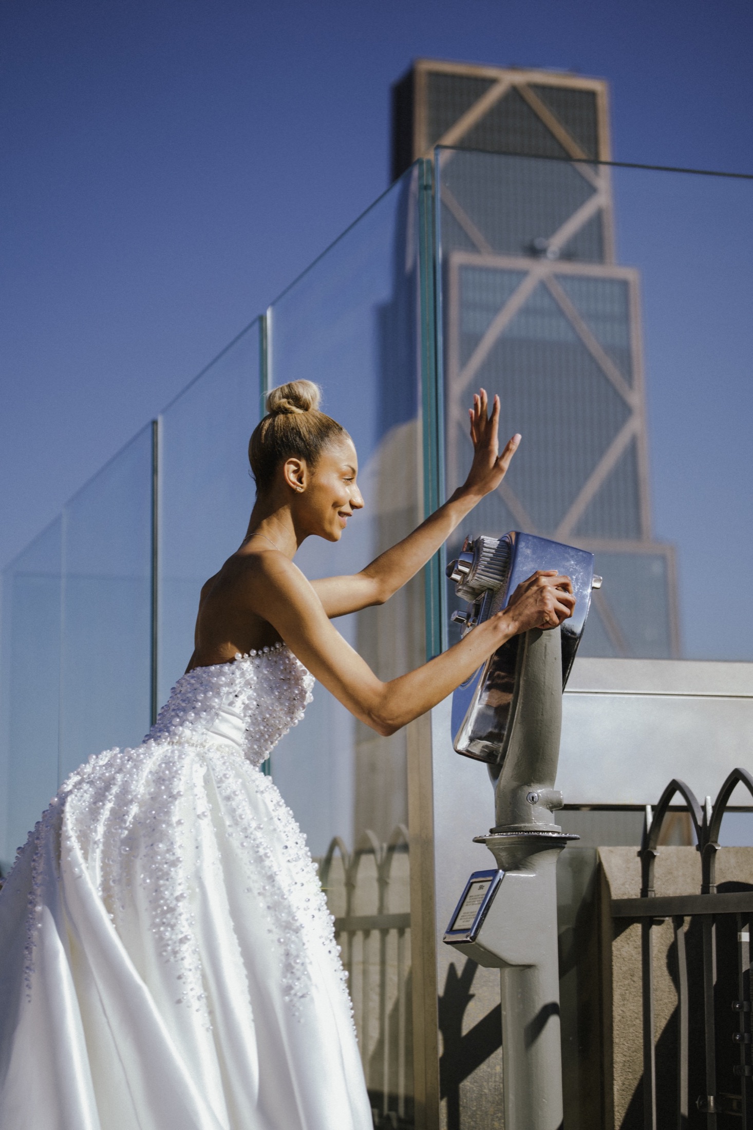 Bride on a rooftop in city light