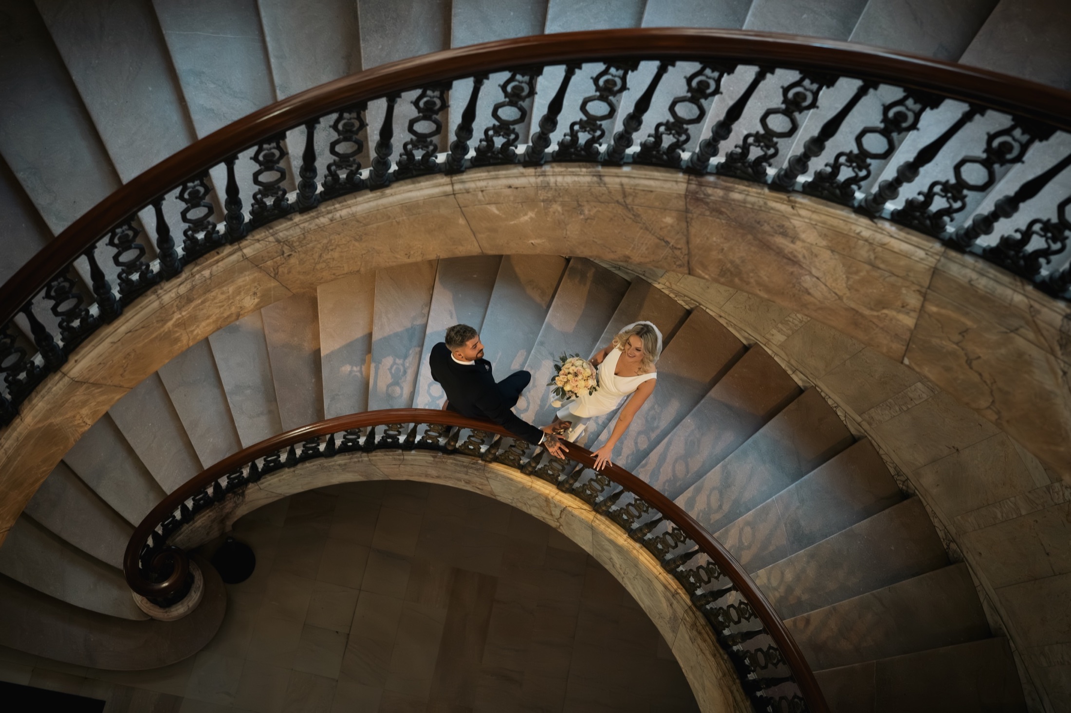 Newlyweds on an elegant staircase