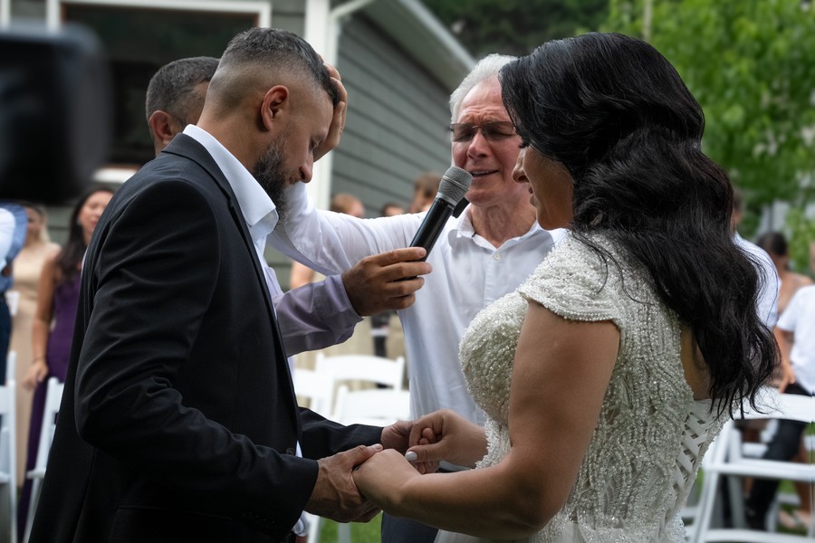The couple smiling during their ceremony